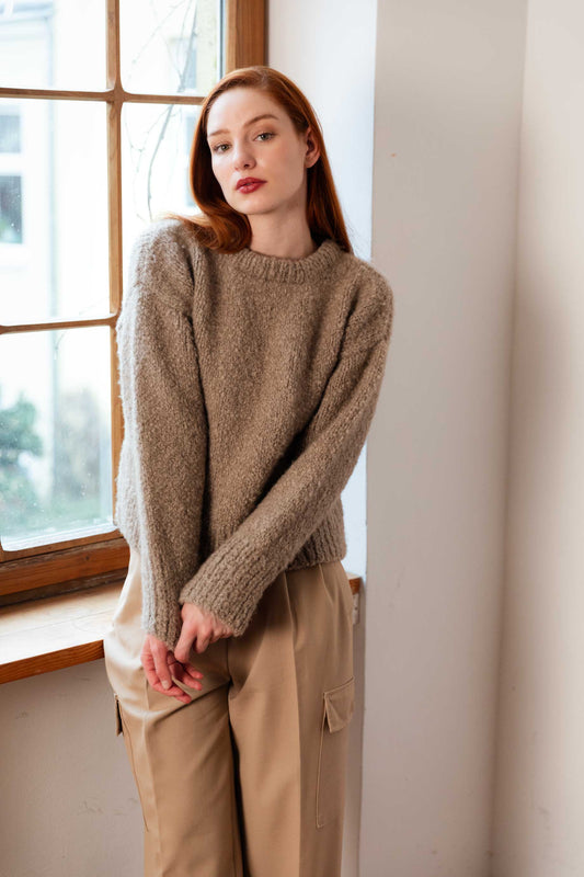 Woman wearing a 100% Mongolian cashmere sweater.