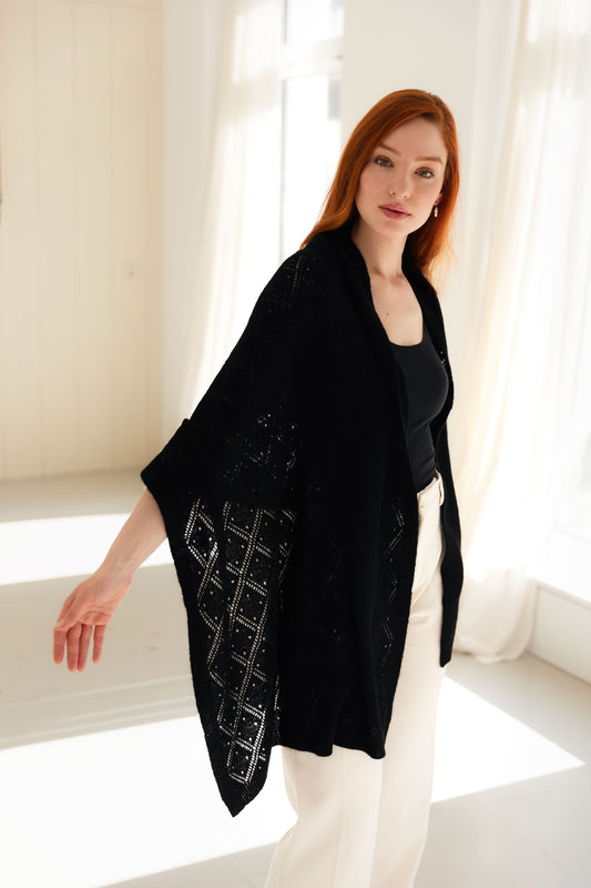 Woman wearing a black lace cashmere shawl