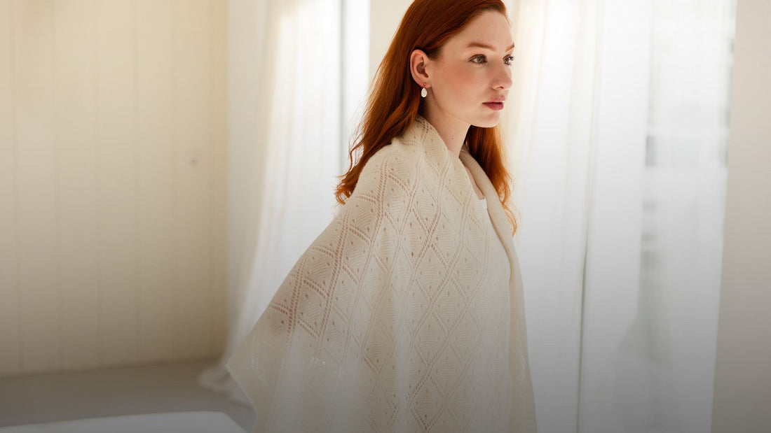 Woman wearing a white cashmere lace scarf