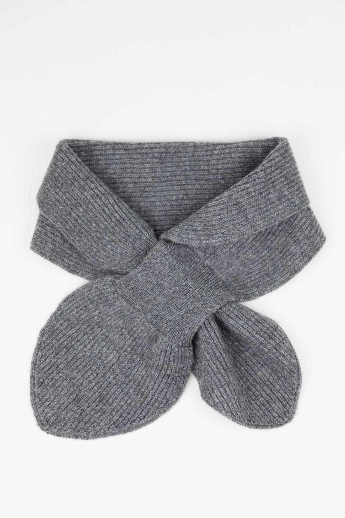 Flat lay of a Slate Grey cashmere mini scarf showing the ribbed texture and the functional keyhole pull-through design.