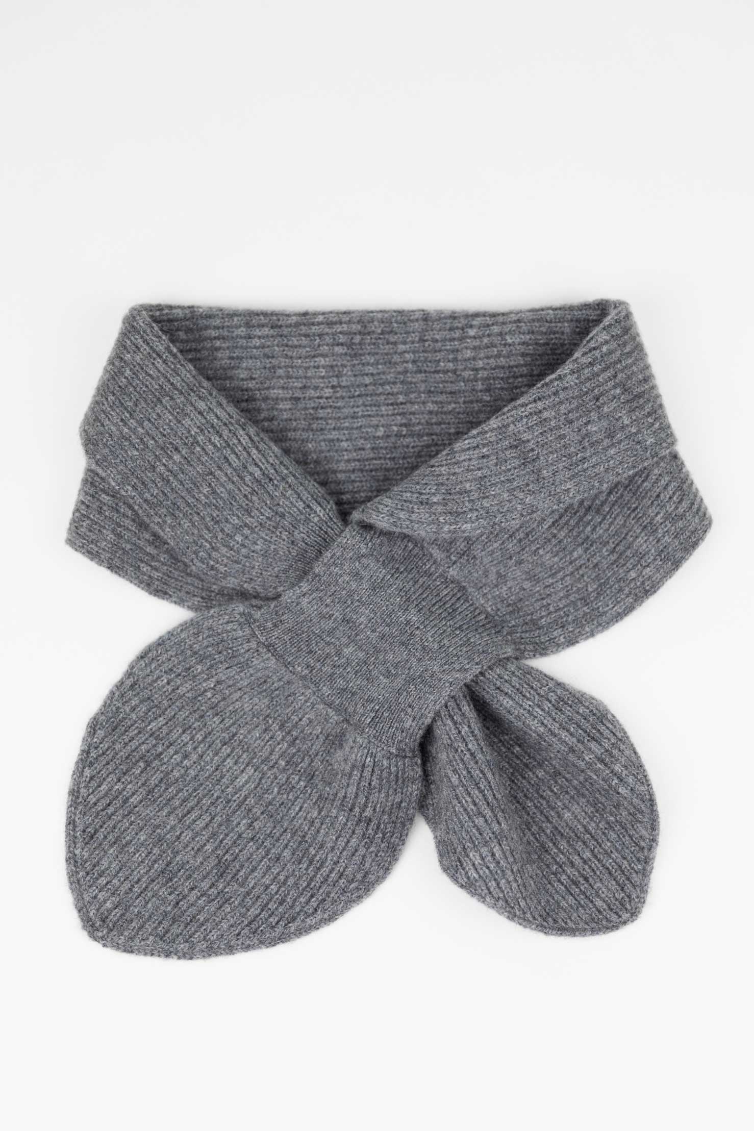 Flat lay of a Slate Grey cashmere mini scarf showing the ribbed texture and the functional keyhole pull-through design.