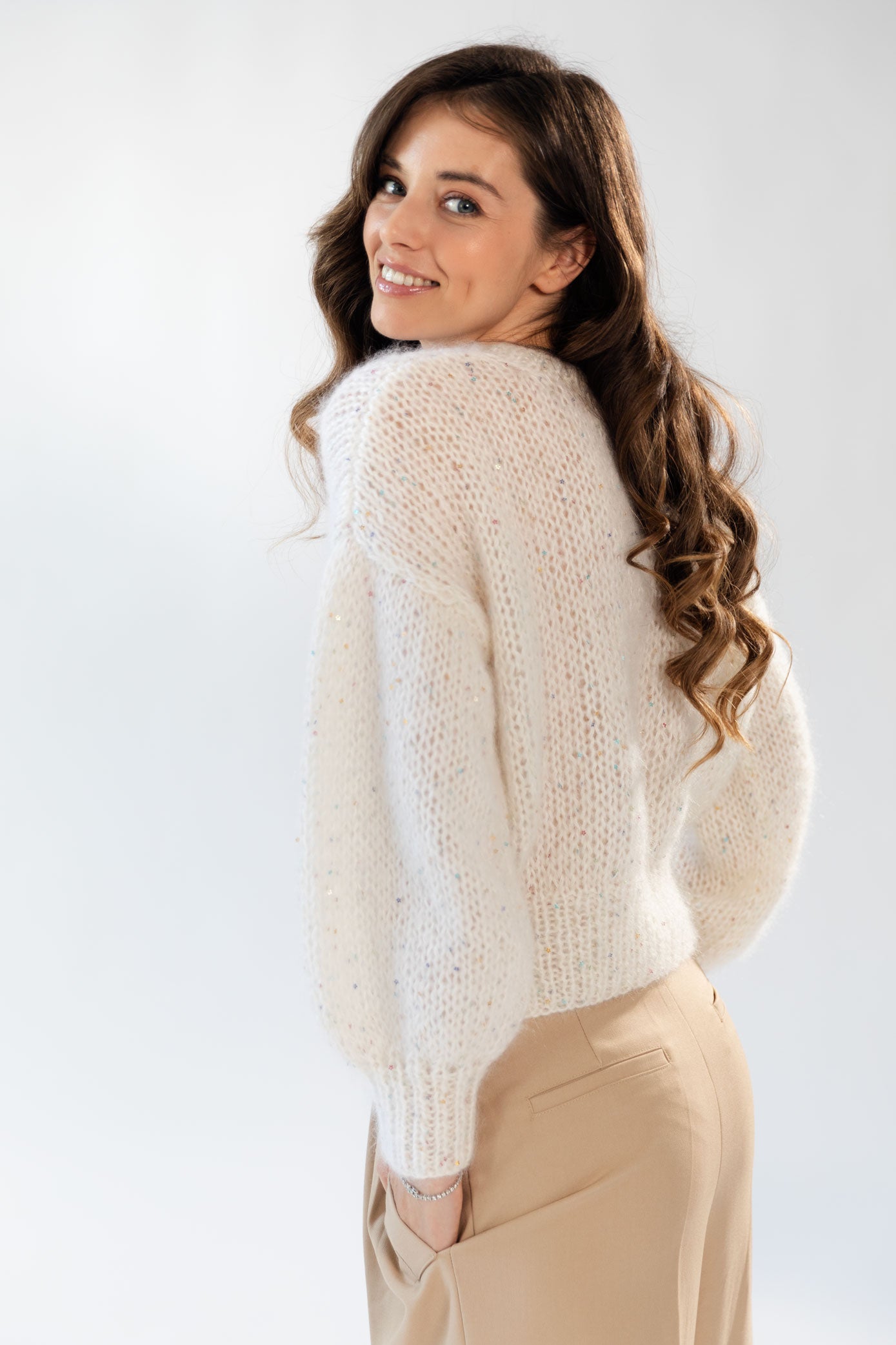 White mohair sweater embellished with delicate flower sequins. 