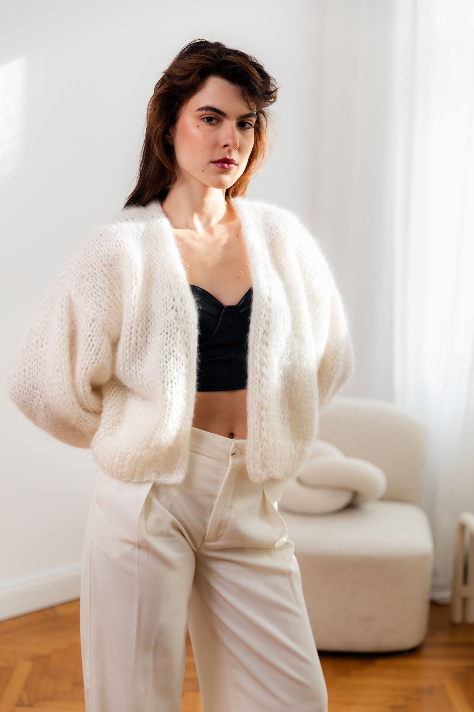 Handmade fluffy mohair cardigan, white colour, with dropped shoulders and balloon sleeves. It has a voluminous and airy texture. Style it with high rise bottoms or a slip dress. Made from premium Italian yarn.