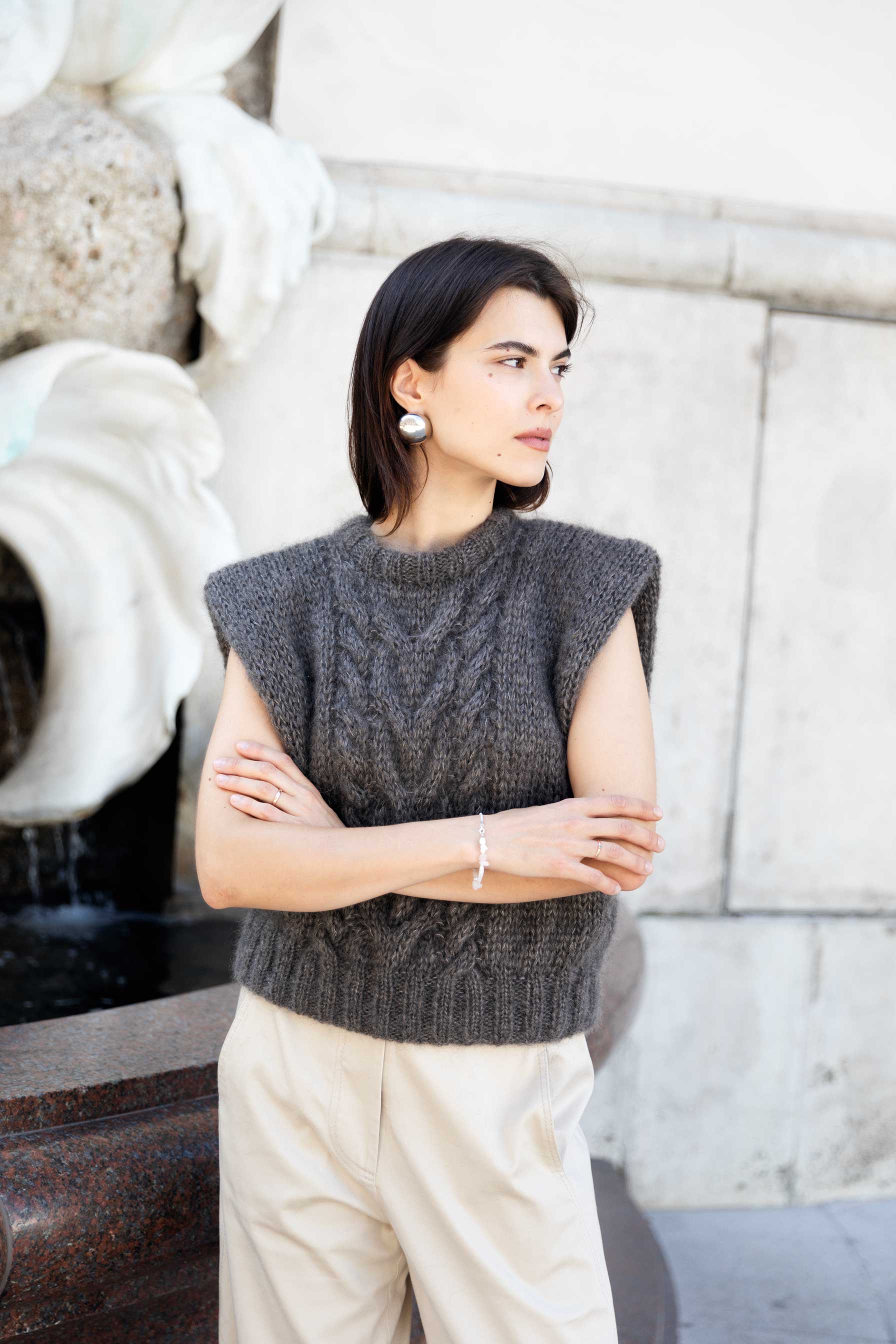 Woman wearing an ash brown mohair sweater vest.