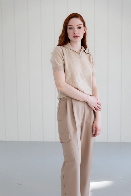 Woman wearing a 100% Mongolian cashmere polo shirt in beige.
