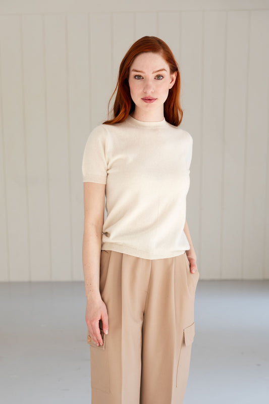 Woman wearing a 100% Mongolian cashmere t-shirt in natural white.