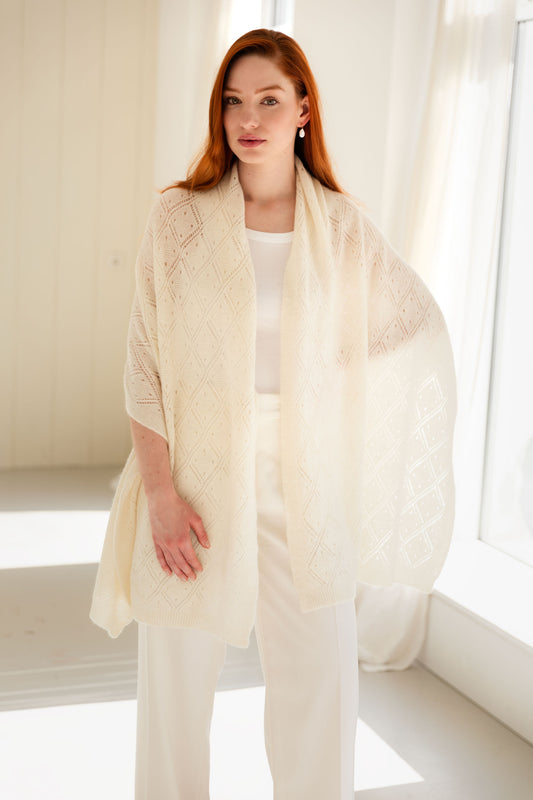 Woman wearing a white lace cashmere shawl