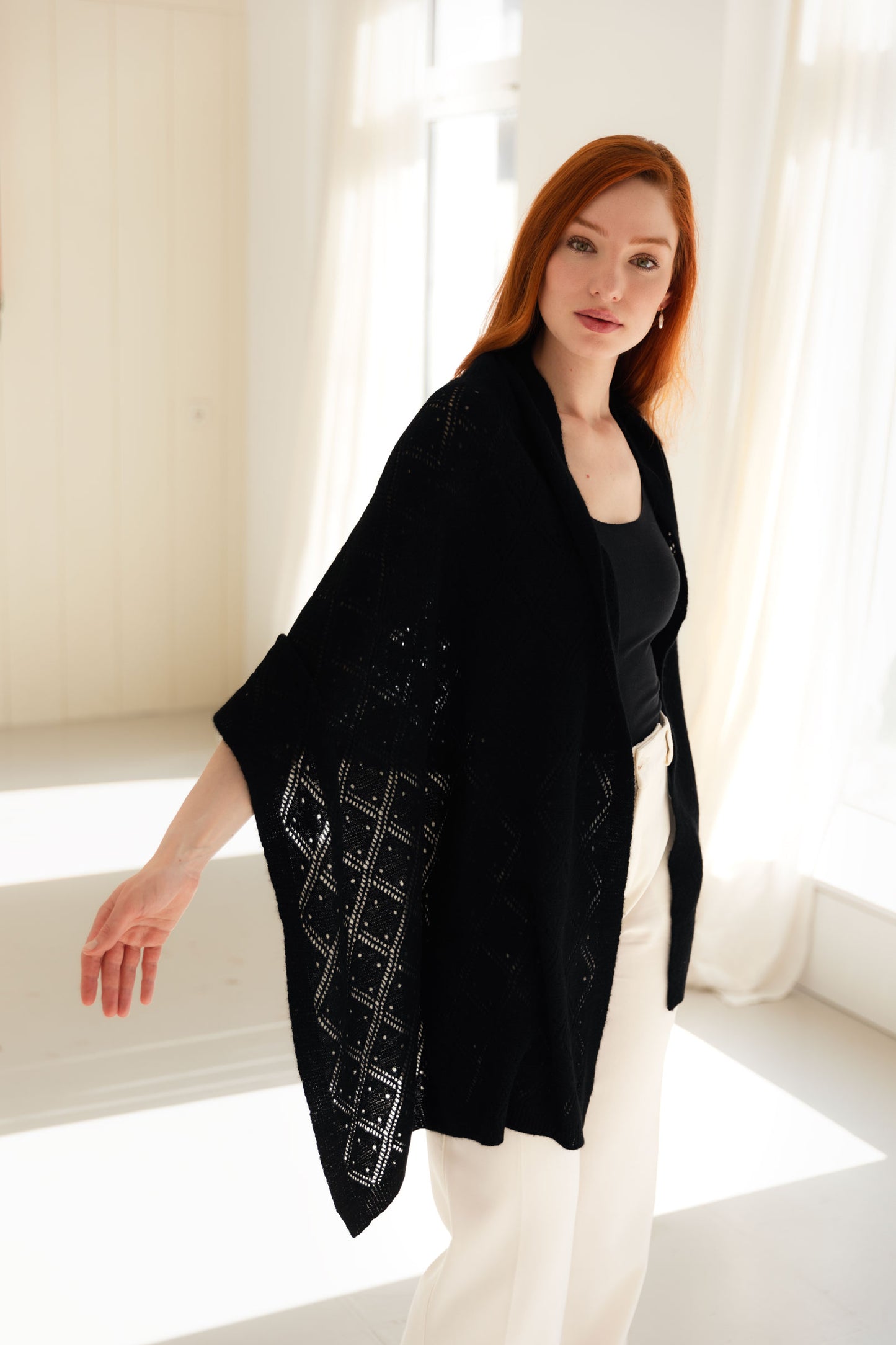Woman wearing a black lace cashmere shawl