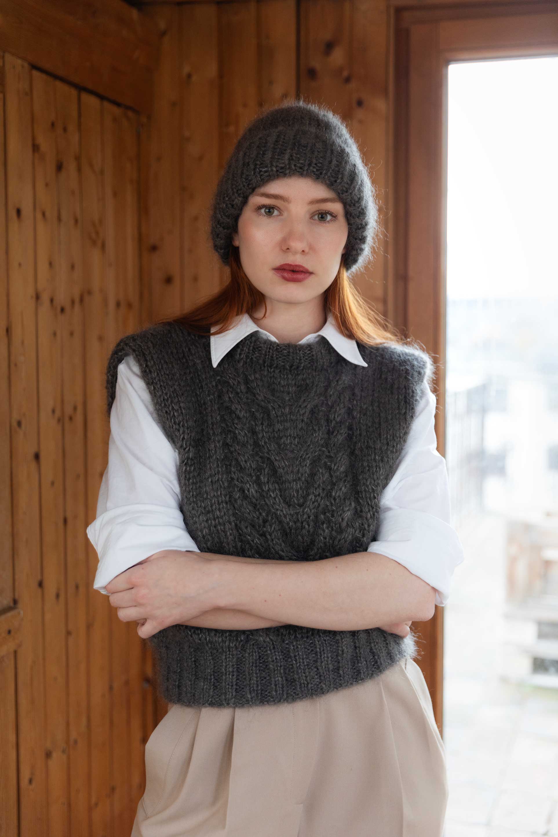 Model wearing brown mohair silk beanie and vest, hand-knitted in Salzburg