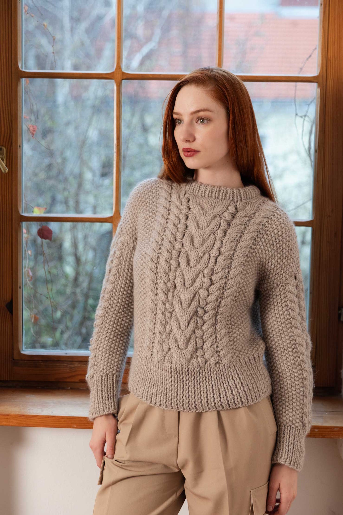 Woman wearing a handmade organic wool sweater