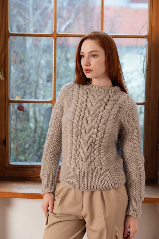 Woman wearing a handmade organic wool sweater