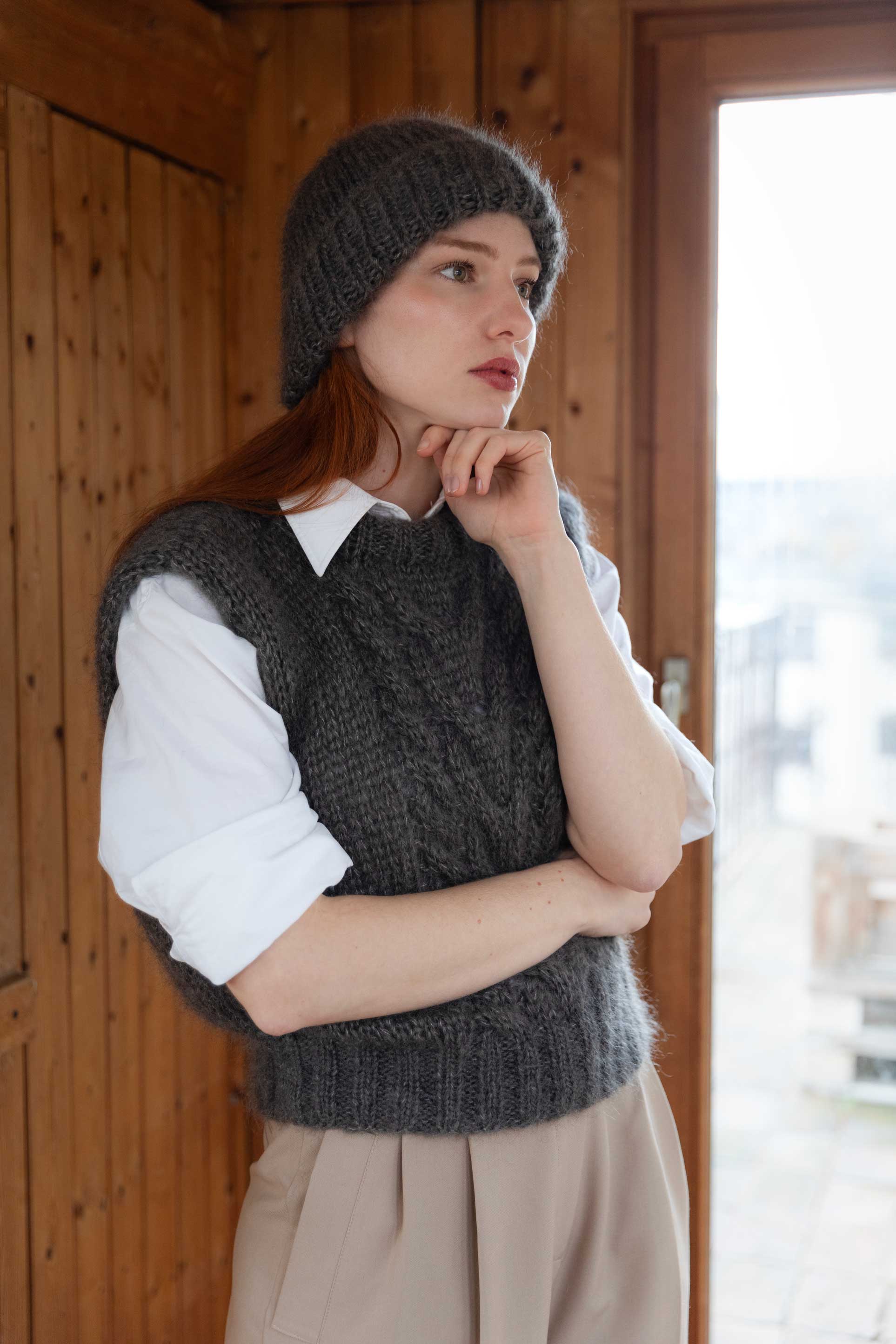 Side profile of model in handmade mohair silk beanie and vest, RMS-certified mohair