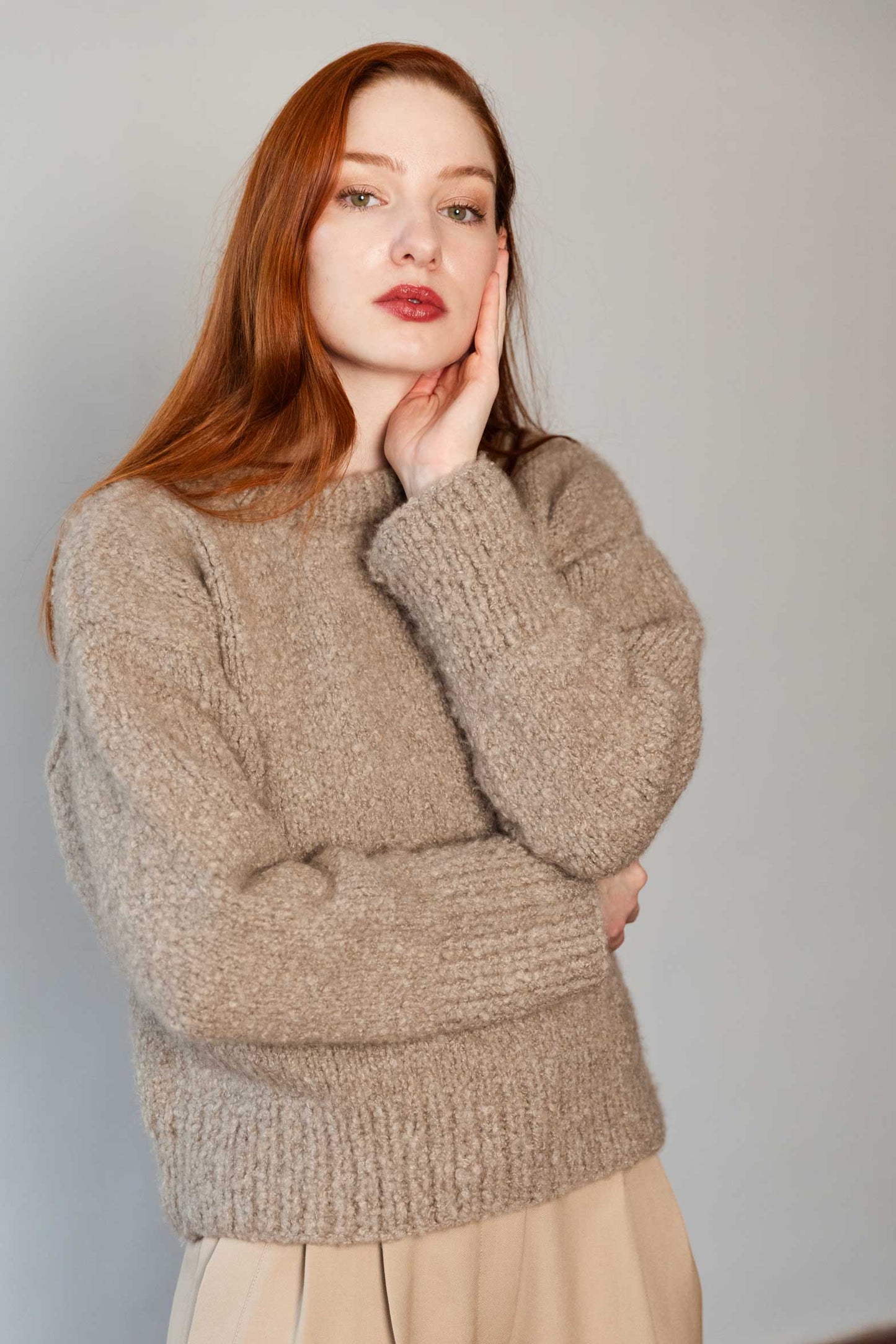Red hair woman wearing a 100% Mongolian cashmere sweater.